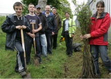 Conservation Volunteers NI get set to plant 200 trees in Lisahally, led by Derry Port environmental officer Peter White, centre and helped by Emma McDermott of Inis Communications, right.